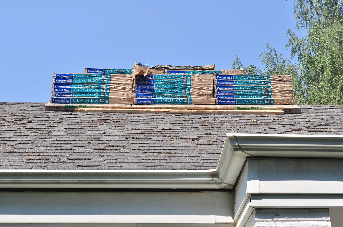 Bundles of new shingles staged on a roof